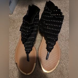 If brand flat sandals. Zip up the back.